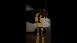 White van painted in road lines in Merseyside, England, UK