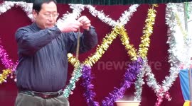 A snake goes through a man's nose and gets out from his mouth