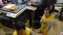 WORLD'S BUSIEST DAD? FATHER OF QUADRUPLETS TAKES THEM TO WORK