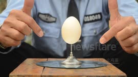 Balancing egg on a pin