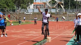 Unicyclist riding 11.7m on 192 bottles