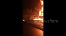 Close-up footage of crane on fire after explosion on the M40 last night