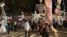 NYC: Costumed revelers march in Village Halloween Parade on 6th Avenue