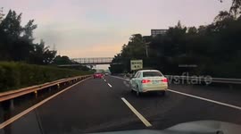 White car sideswipes multiple vehicles in Luzhou, China