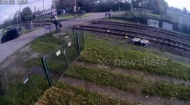 Train crashes into lorry stuck on level crossing sending PEARS flying through the air