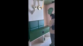 Woman startled and breaks mallet while playing arcade game in Guizhou, China