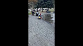 Go-Karts Zig Zag Through a Fountain