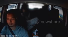 Furious taxi passenger erupts in anger at being stuck in traffic in Jakarta