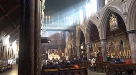 All Souls Day 2025 at St Cuthberts Earls Court with rays of sun and sound of church bells