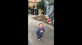 Playful dog accidentally pounces on toddler while popping bubbles in Shanghai City, China