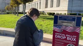 Voters cast ballots at San Francisco City Hall for Proposition 50