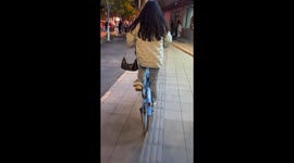 Woman rides shared bicycle without a seat in Liaoning, China