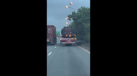 Drivers shocked by fire burning on the back of asphalt tanker