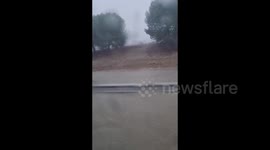 Spain: Car Navigates Severe Flooding in Benacazón