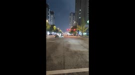 Two scooters collide at an intersection in Sichuan, China