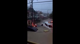 Cars swept away during floods triggered by Typhoon Kalmaegi