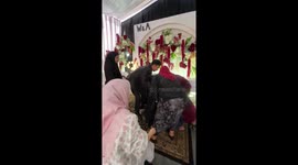 Bride pretends to faint to surprise husband on his birthday during wedding