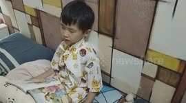 Sleepy Scholar: Kid Dozes Off While Reading Bedtime Book