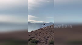 Helicopter battles wildfire raging through Cleveland National Forest