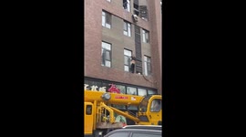 Worker stuck by safety harness rescued by passing crane operator