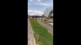 Woman Waves and Crashes Electric Scooter