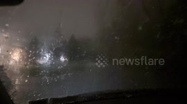 Lightning and hailstorm illuminate the night sky in Rochester, New York