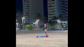 Boy falls attempting scooter jump trick in Guarujá, São Paulo, Brazil