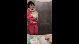 Baby laughs with other people but ignores dad during playtime in Shaanxi, China