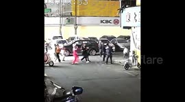 Drunk woman falls from rooftop only to be caught by police and pedestrians below