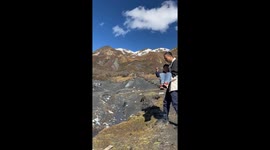 Father and son tumble during jump in Sichuan mountains, China