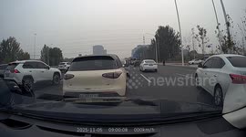 White car crashes into pole after sudden lane cut in Beijing, China