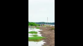Container ships cause giant wave as it passes through port in Vietnam
