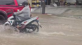 Floods submerge roads as heavy rain hits Thai island Phuket