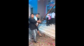 Man demonstrates DIY tripod in Hainan, China