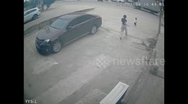 Mum sprints to rescue after toddler bolts towards busy road after slipping past doorway barrier