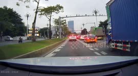 Motorcycle collides with car door on busy highway in Guangdong, China