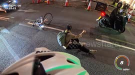 Close Call: Cyclist's Near Miss Highlights Safe Passing Distance. He was passing too close to the moped rider and falls sideways onto the road about 1.5 meters.