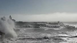 Powerful waves crash along the shore in Santa Cruz, California, USA