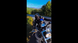 Pet dog enjoys a motorcycle ride in Barcelona, Spain