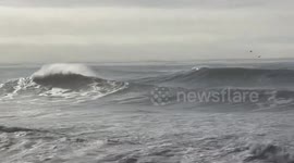 Powerful waves crash along the coast in Santa Cruz, California, USA