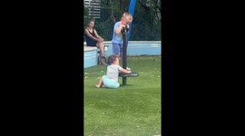 Boy hilariously loses balance on stand-up spinner in Miami, Florida, USA