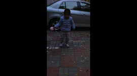 Girl trips while playing with rope and ball in Liaoning, China