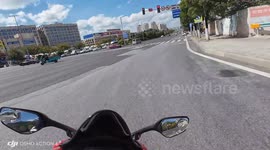 Motorcycle crashes into car in Guizhou, China