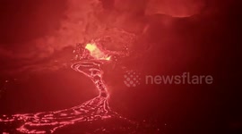 US: Lava Spectacularly Flows from Volcano at Dusk