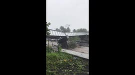 Bridge begins to collapse under floodwaters in Guinobatán, Albay, Philippines