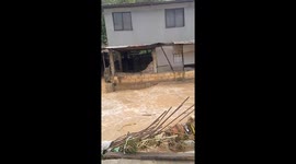 Eroding house begins sliding as floodwaters rage in Consolacion, Cebu, Philippines
