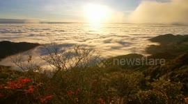 China: Sea of clouds rolling over green mountains creates stunning scene in Guangxi