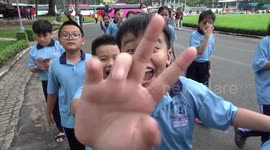 Hundreds of Vietnamese Children Visiting the Reunification Palace in Saigon Love the Camera