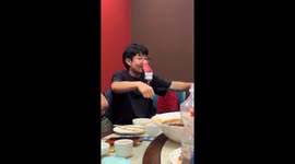 Man imitates motorcycle sounds using soda can in Tianjin, China