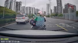 Dashcam captures collision between car and motorcycle in Guangdong, China